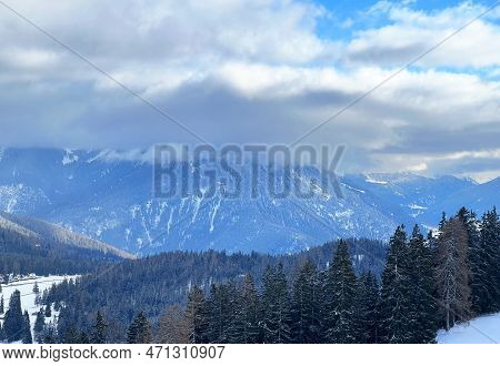 Beautiful Low Winter Clouds And Fog Condensation In The Swiss Alps Above The Tourist Resorts Of Valb