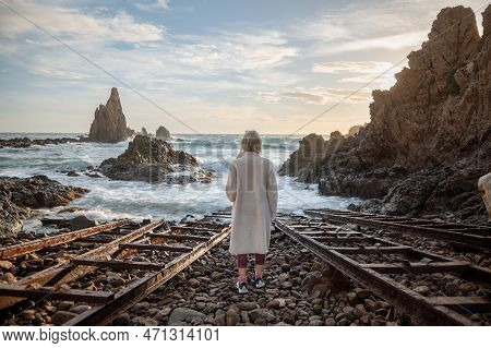 Cabo De Gata, Spain : 2022 November 17 : Woman Lookingthe Sea In The Natural Harbor Of The Lighthous