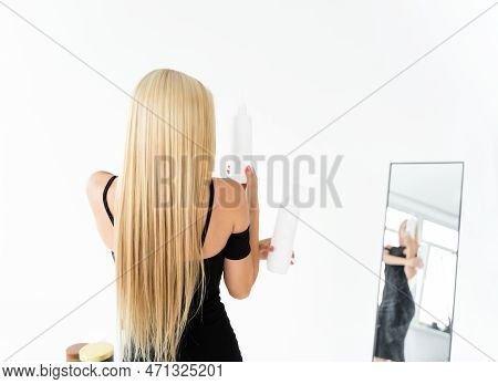 Blonde Girl With Keratin Hair Straightening Turned Back. Keratin Hair Restoration. Care For Straight