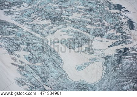 Beautiful Nature Background Of Glacier Tongue With Cracks Closeup. Colorful Natural Backdrop Of Glac