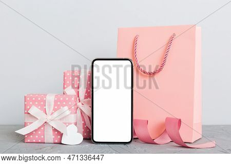 Mobile Phone With Blank Screen On Colored Background With Hearts, Calendar And Gift Box, Valentine D