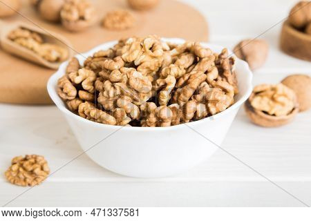Fresh Healthy Walnuts In Bowl On Colored Table Background. Top View Healthy Eating Bertholletia Conc