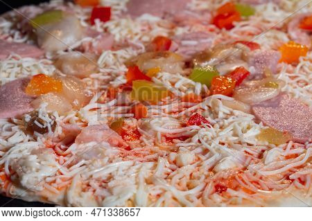 Uncooked Pizza With With Ham, Mushroom, Pepper, Cheese In Electric Oven - Close Up View, Macro. Ital