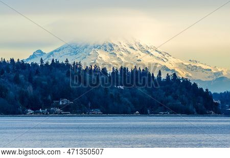 Clouds Cover Mount Rainier Across The Puget Soud In Washington State.