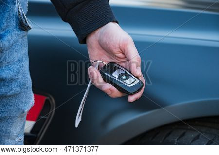 Slovenia, Ljubljana - 31 January 2023: Bmw M4 High Performance Car With Hand Holding Key