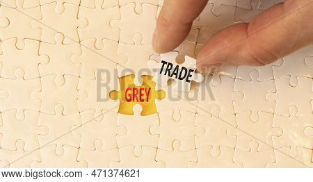 Grey Trade Symbol. Concept Words Grey Trade On White Paper Puzzles. Beautiful Yellow Table Yellow Ba