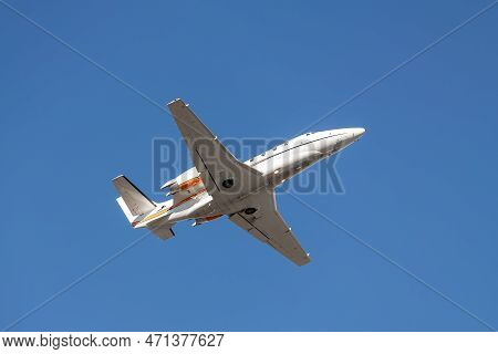 Scenic Close Bottom View Modern Luxury Expensive White Private Jet Plane Dispatching From Airport Is