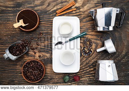 Cup Of Coffee, Geyser Coffee Maker, Milk And Beans Coffee On, Dark Wooden Table. Top View.