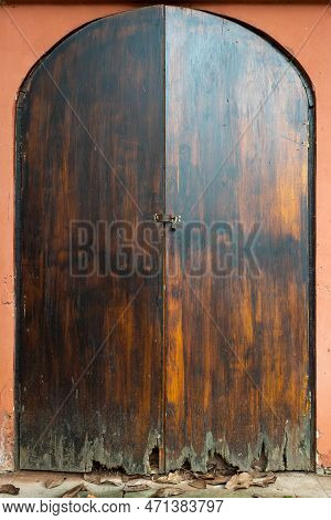Ancient Closed Wooden Door On A Red Wall In A Taoist Temple, Luodai, Sichuan Province, China