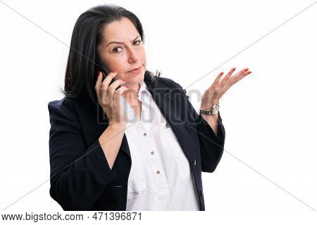 Adult Businesswoman Making Phonecall With Confused Expression And Gesture As Office Corporate Concep