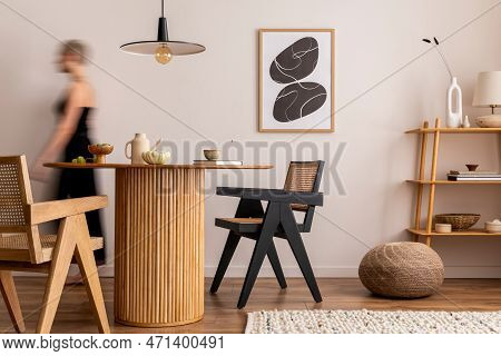 Warm And Cozy Interior Of Living Room Space With Mock Up Poster Frame, Round Table, Rattan Chairs, P