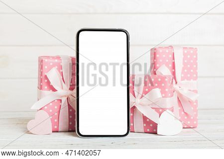 Mobile Phone With Blank Screen On Colored Background With Hearts, Calendar And Gift Box, Valentine D