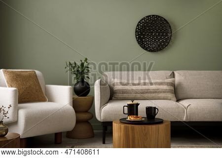 Stylish Composition Of Living Room Interior With Green Wall, Grey Sofa With Pillow. White Armchair W
