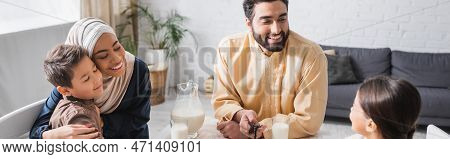 Positive Middle Eastern Family Talking During Suhur In Morning At Home, Banner.