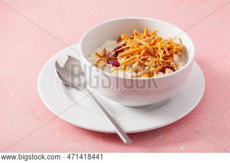 Rice Pudding With Norwegian Brunost Traditional Brown Cheese And Raspberry Jam