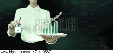 Lady In Office Suit Holding Tablet And Pen. Pointing On Fufturistic Element On Screen. Image With Co