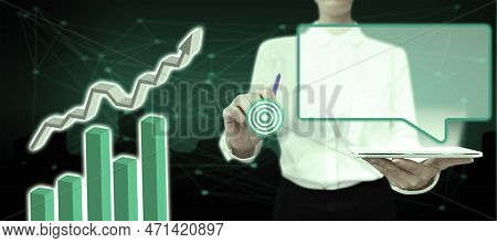 Lady In Office Suit Holding Tablet And Pen. Pointing On Fufturistic Element On Screen. Image With Co
