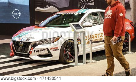 View Of Nissan Sentra Sport Car On Display. Crowds Looking At New Car Models At Auto Show. National