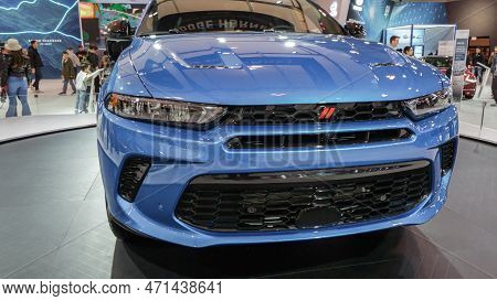Blue Dodge Car On Display. Crowds Looking At New Car Models At Auto Show. National Canadian Auto Sho