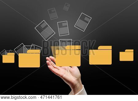 A Female Hand And Virtual Icons Of Folders And Files, A Concept Of Data Organization And Archiving, 