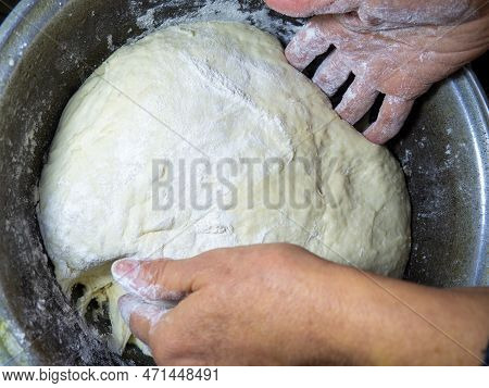 Raw Thick Dough In The Hands Of A Woman Baker. Ready Dough For Baking In A Pan. Test Batch. Cook's H