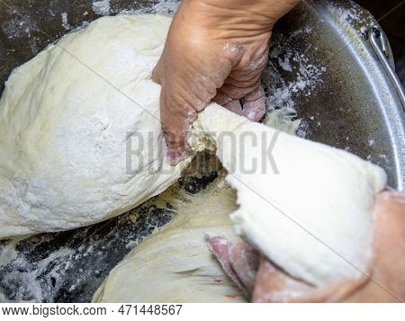Raw Thick Dough In The Hands Of A Woman Baker. Ready Dough For Baking In A Pan. Test Batch. Cook's H
