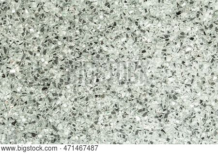 Abstract Blurred Background Of Small Pebbles In White And Gray