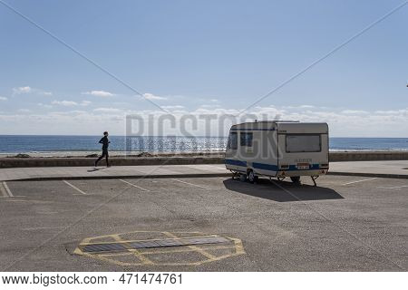 Sa Coma, Spain; February 17 2023: Caravan Parked On The Seafront Of The Tourist Resort Of Sa Coma On
