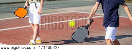 Banner Pickleball Game Sport, Boy And Girl Playing Match Hitting Pickleball Yellow Ball With Colorfu