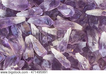 A Stack Of Amethyst Crystals With Vitreous Luster And Prismatic Tips. A Transparent Variety Of Quart