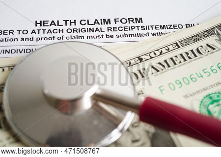 Health Claim Form With Stethoscope And Us Dollar Banknotes, Insurance Accident Medical Concept.