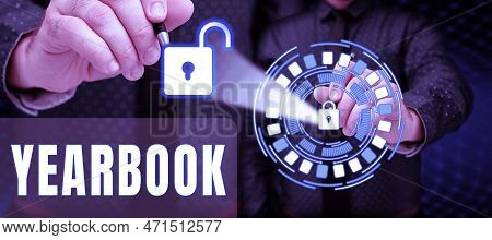 Hand Writing Sign Yearbook. Internet Concept Publication Compiled By Graduating Class As A Record Of