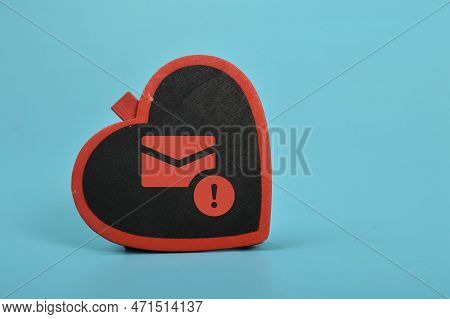 Love Board And Email Symbol. The Concept Of Love Scams Online Involves Using Email Phishing Scams