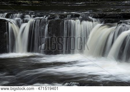 Beautiful Peaceful Landscape Image Of Aysgarth Falls In Yorkshire Dales In England During Winter Mor