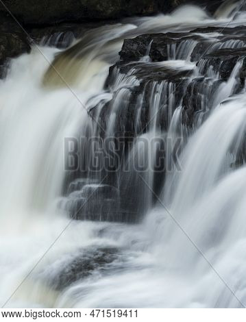 Beautiful Peaceful Landscape Image Of Aysgarth Falls In Yorkshire Dales In England During Winter Mor