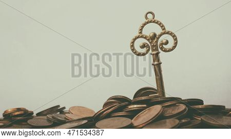 Euro Cents With An Ancient Key. Money Opens Many Doors. Ancient Key On Coins. Retro Effect