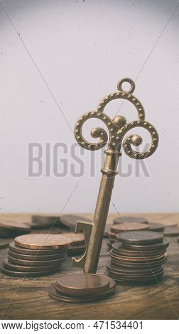 Euro Cents With An Ancient Key. Money Opens Many Doors. Ancient Key On Coins. Retro Effect