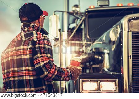 American Heavy Duty Ground Transportation Job. Semi Truck Driver Getting Ready For His Job Finishing