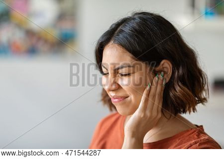Sick Young Arab Woman Having Ear Pain At Home