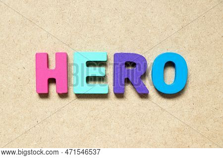 Color Alphabet Letter In Word Hero On Wood Background