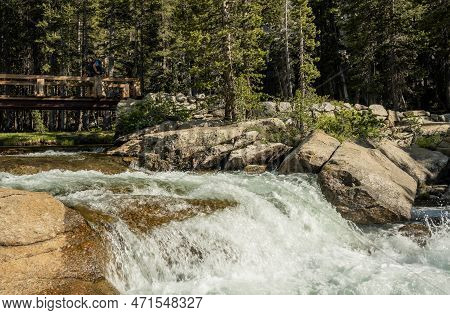 Water Cascades Over Rock Shelf In The Tuolmne River