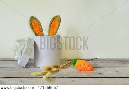 Easter Eggs And A White Basket With Rabbit Ears
