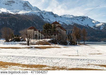 Silvaplana, Switzerland, February 21, 2023 Historic Old Castle Crap Da Sass At The Lake Of Silvaplan