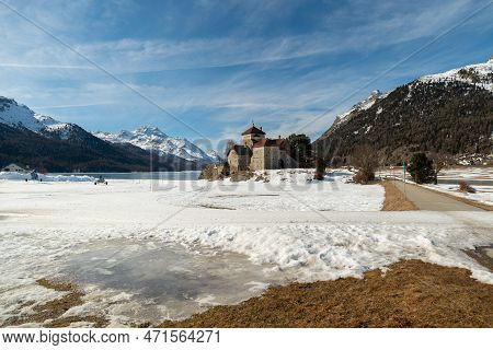 Silvaplana, Switzerland, February 21, 2023 Historic Old Castle Crap Da Sass At The Lake Of Silvaplan