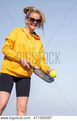 Portrait Woman Player Pickleball Game Over Blue Sky, Pickleball Yellow Ball With Paddle, Outdoor Spo