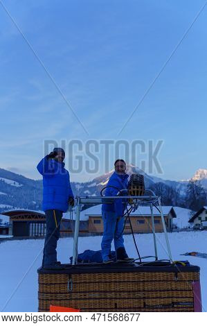 Two Men Setting Up A Hot Air Balloon. Taken At 42nd International Balloon Festival In Chateau D'oex 