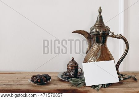 Ramadan Kareem Still Life. Ornamental Cup, Arabic Dallah Coffee Pot And Blank Greeting Card Mockup. 
