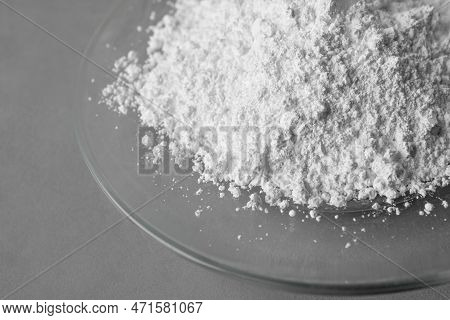 Plate With Calcium Carbonate Powder On Grey Table, Closeup