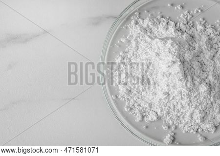 Petri Dishes With Calcium Carbonate Powder On White Marble Table, Closeup. Space For Text