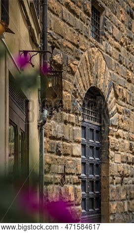 Medieval Renaissance Gothic Buildings And Flowers On A Narrow Street In Oltrarno Santo Spirito, Cent